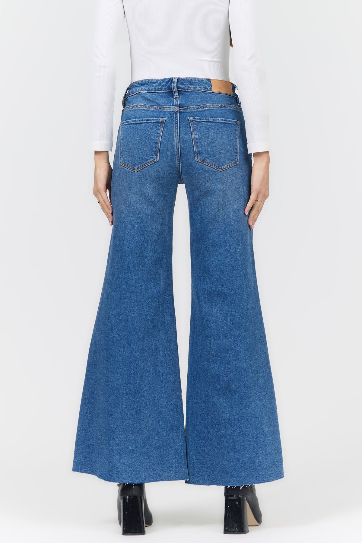 HENDRIX MID RISE WIDE LEG JEANS SOBRANCE BACK — Dear John Denim